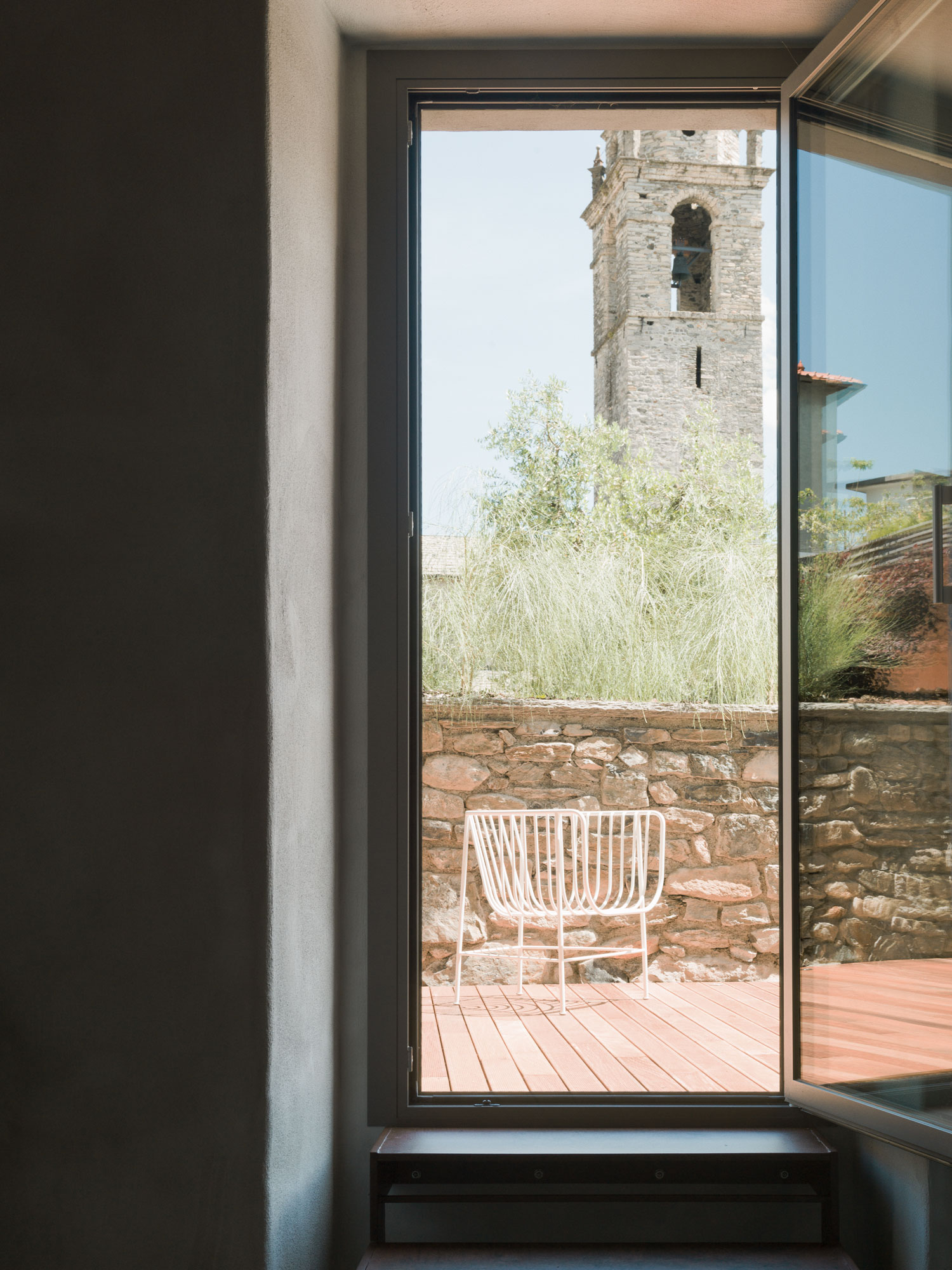 Casa Olea Hotel is a renovated old vicarage located in Cremia, Lake Como - Italy. With the rustic original wooden beams and stone vaulted bathroom, The Junior Suite with garden side patio is the most historically preserved room.