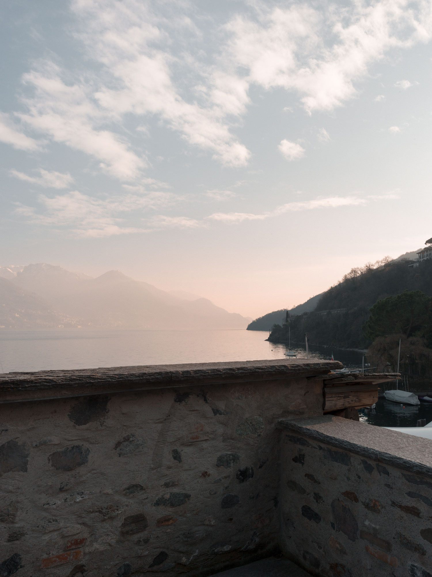 Casa Olea Hotel is a renovated old vicarage located in Cremia, Lake Como - Italy. The most prestigious and spacious corner suite features an impressive view of the front lake terrace overlooking the courtyard garden.